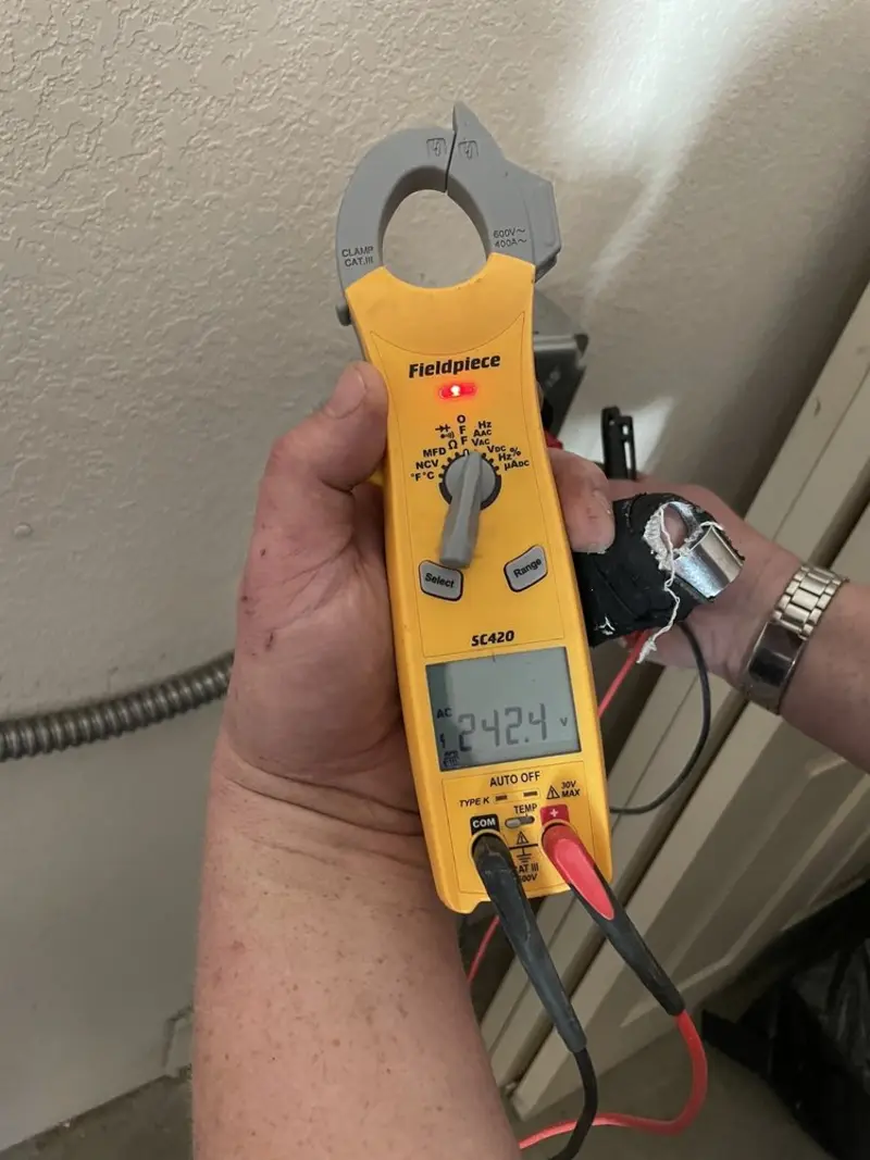 Voltage testing with clamp meter during Electrical Installation Services in Escondido